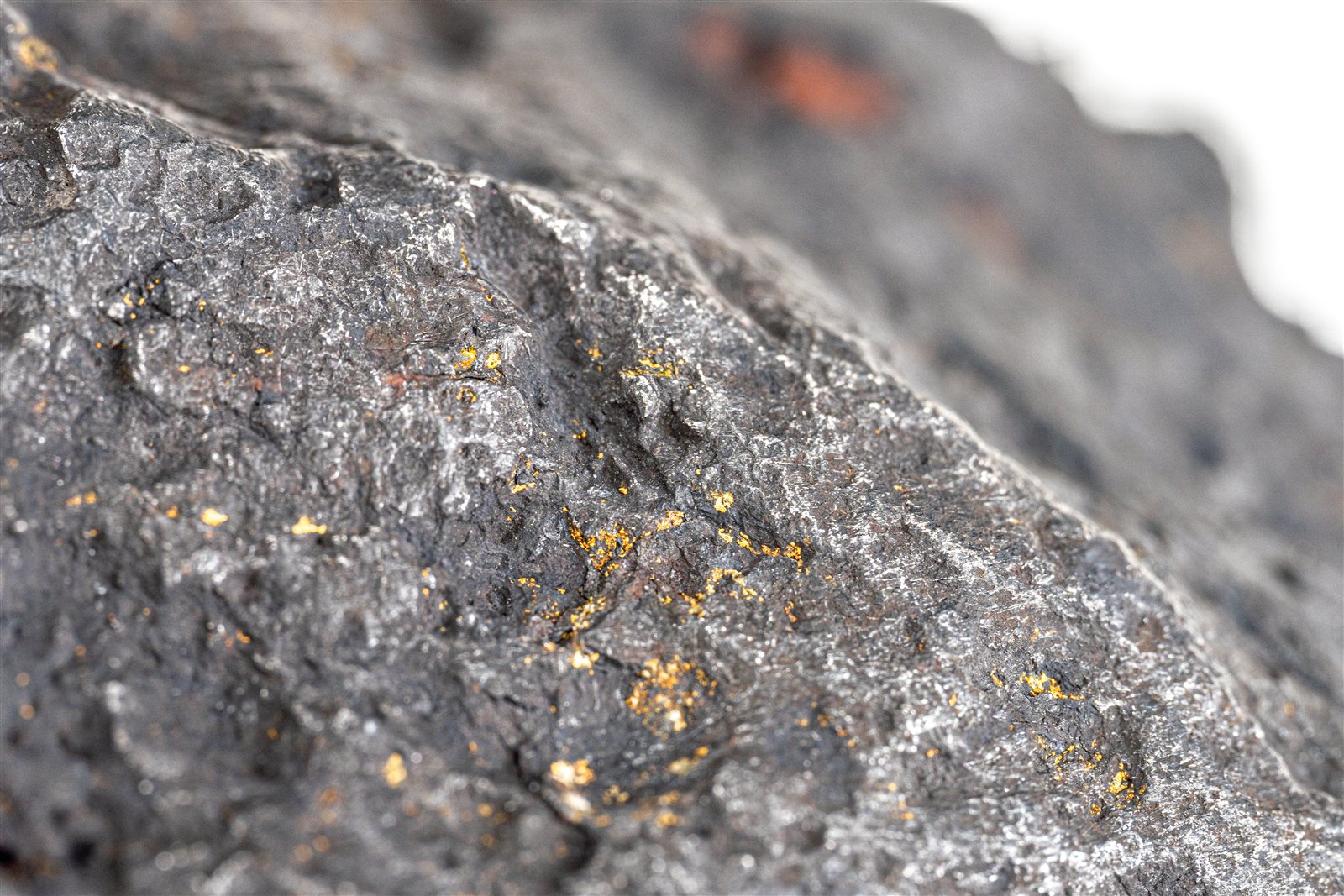 Close-up of metal-rich meteorite material showing nickel-iron inclusions